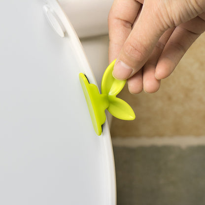 Lève-abattant de toilettes à feuilles