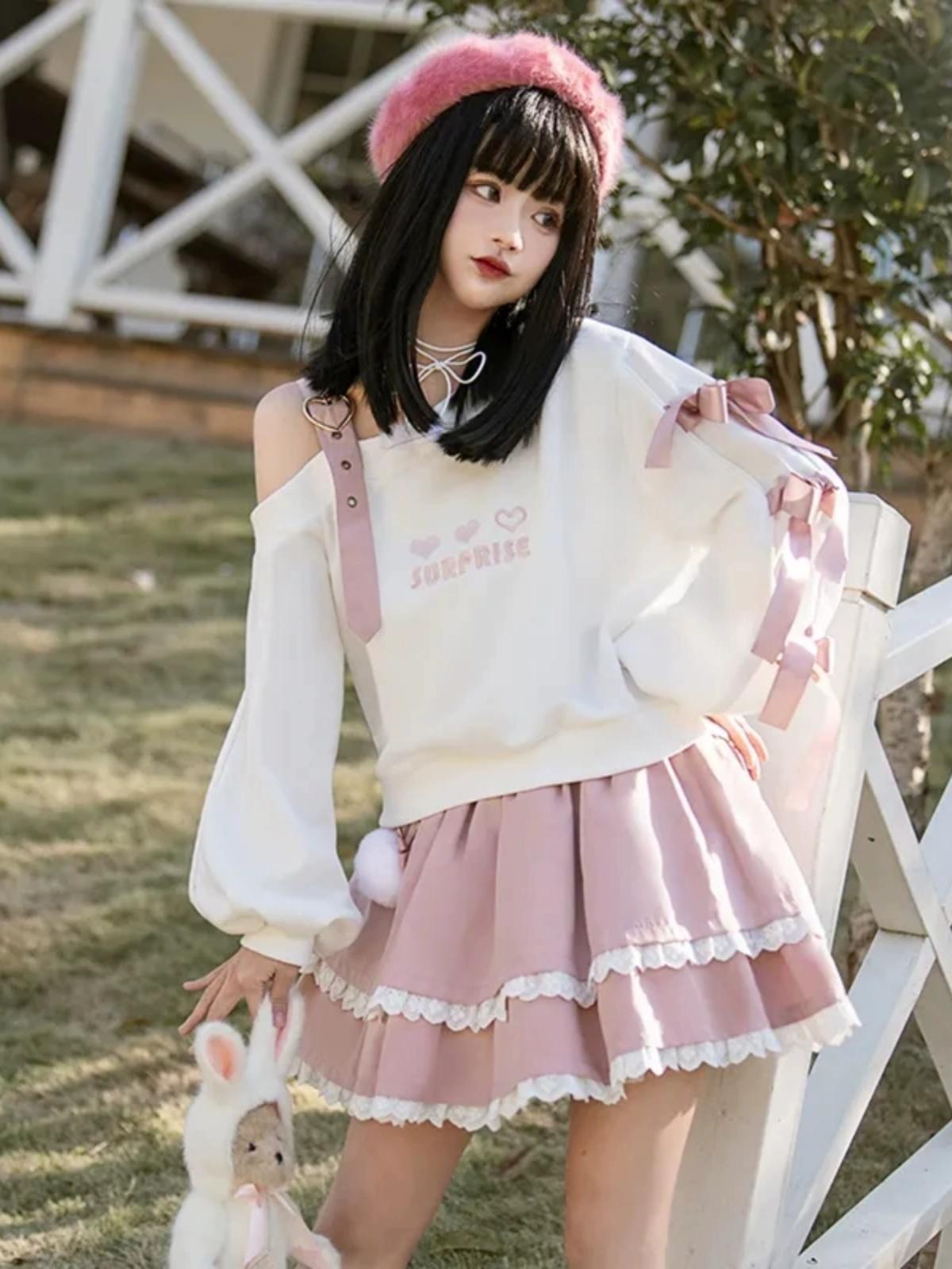 Pull à épaules dénudées avec nœud papillon Loli